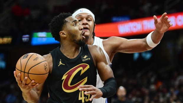 Dec 6, 2023; Cleveland, Ohio, USA; Cleveland Cavaliers guard Donovan Mitchell (45) drives to the basket against Orlando Magic forward Paolo Banchero (5) during the second half at Rocket Mortgage FieldHouse.